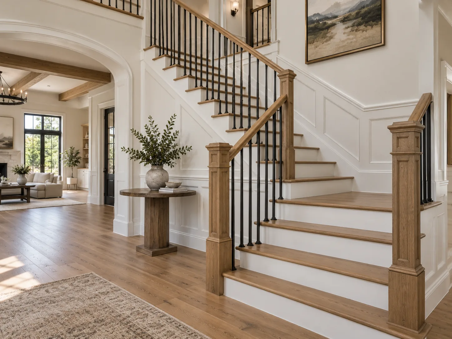 Finished staircase with custom oak newel posts and black metal balusters
