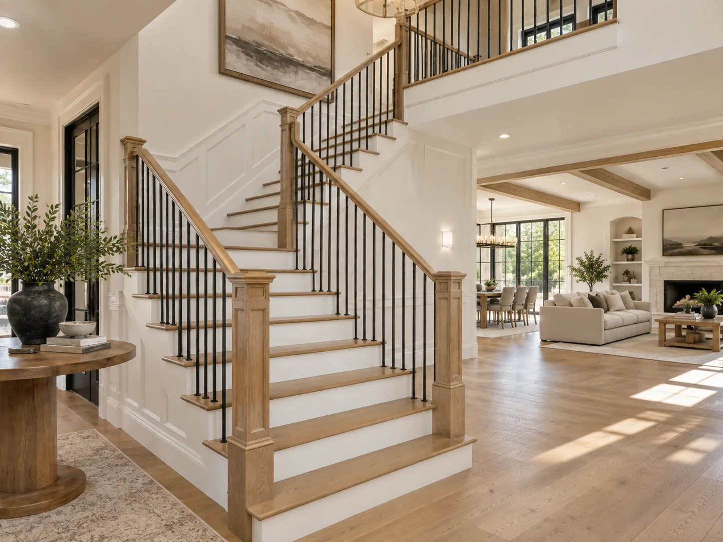 Split staircase with coordinated oak railings and black metal balusters